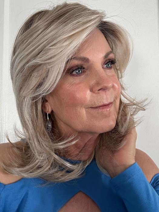 Susan Sparks @sparkles_intheworld wearing GODDESS by RAQUEL WELCH WIGS in color RL19/23SS SHADED BISCUIT | Light Ash Blonde Evenly Blended with Cool Platinum Blonde and Dark Roots