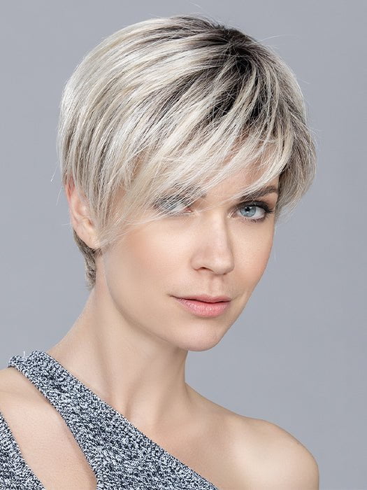 The pixie haircut features a longer fringe for a stylish hairstyle